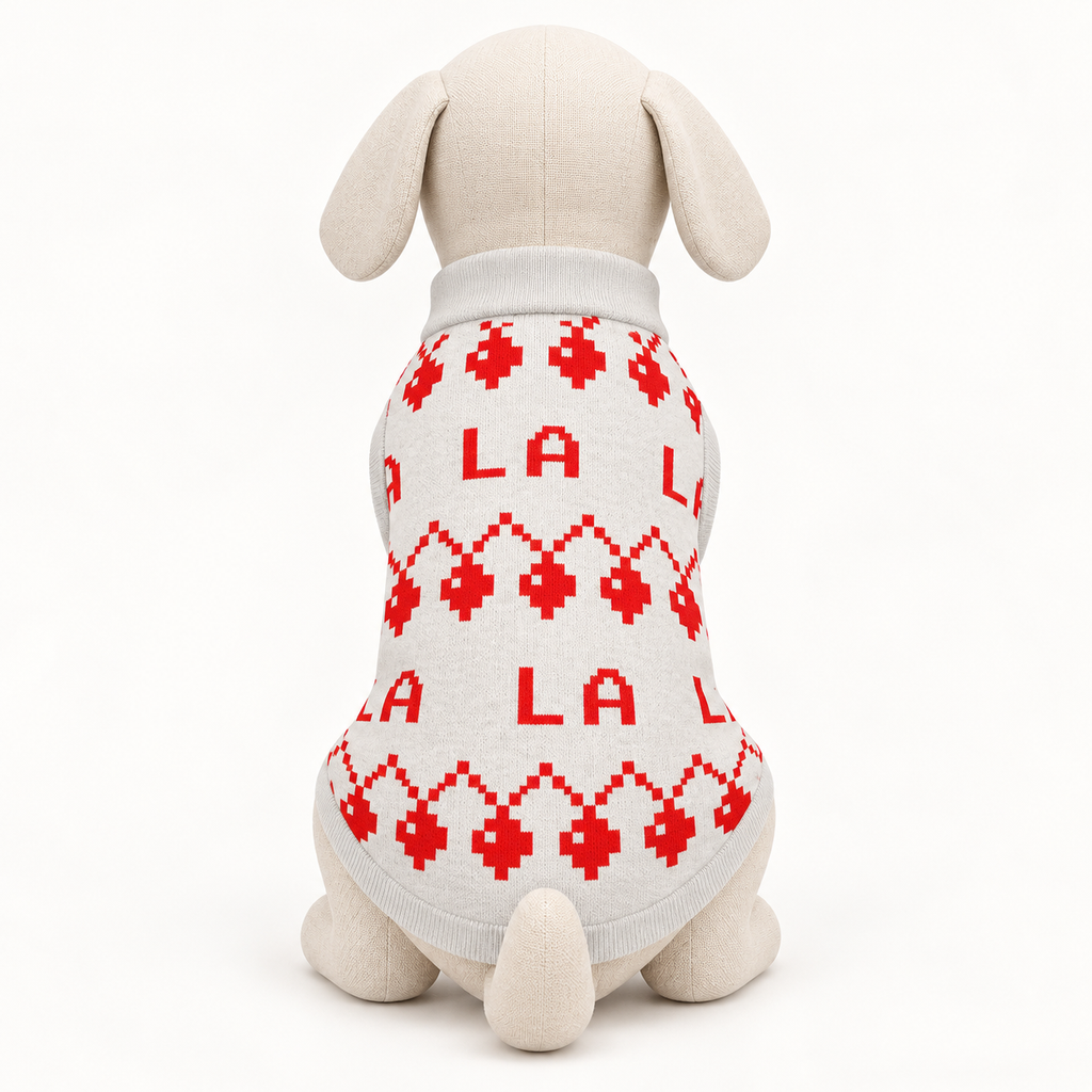 Back view 2xs mannequin wearing a ivory knit dog sweater with red lettering and geometric Christmas motifs, on a white background.