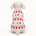 Back view 2xs mannequin wearing a ivory knit dog sweater with red lettering and geometric Christmas motifs, on a white background.
