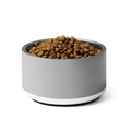 Gray pet bowl with dog food on a white background