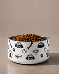  White stainless steel dog bowl with black modern dog icon pattern and kibble, by Uncommon Canine Couture Co.