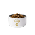 White pet bowl with 'Lilly' and a paw print, filled with pet food on a white background