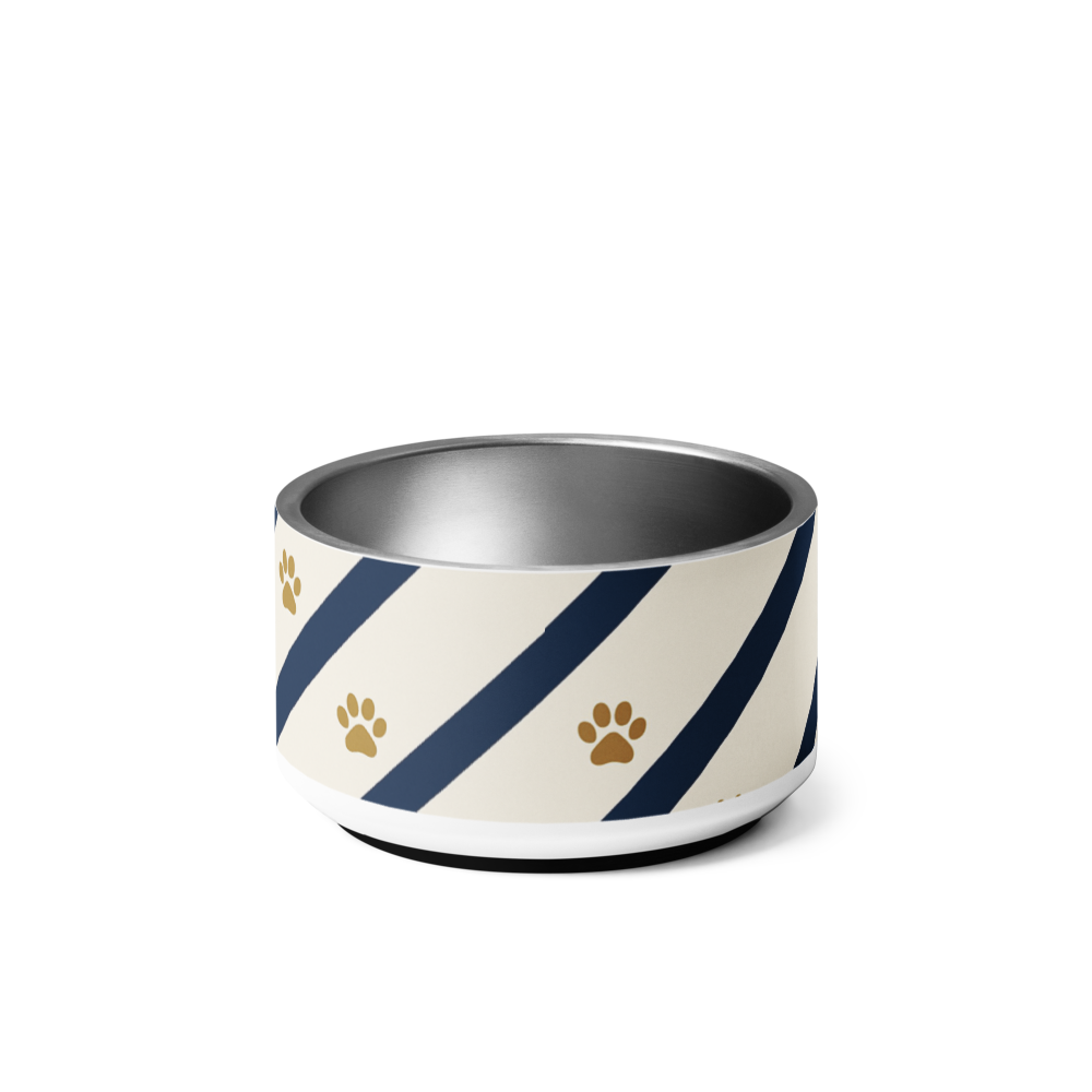 Dog bowl with blue and gold striped pattern and paw prints on a ivory background