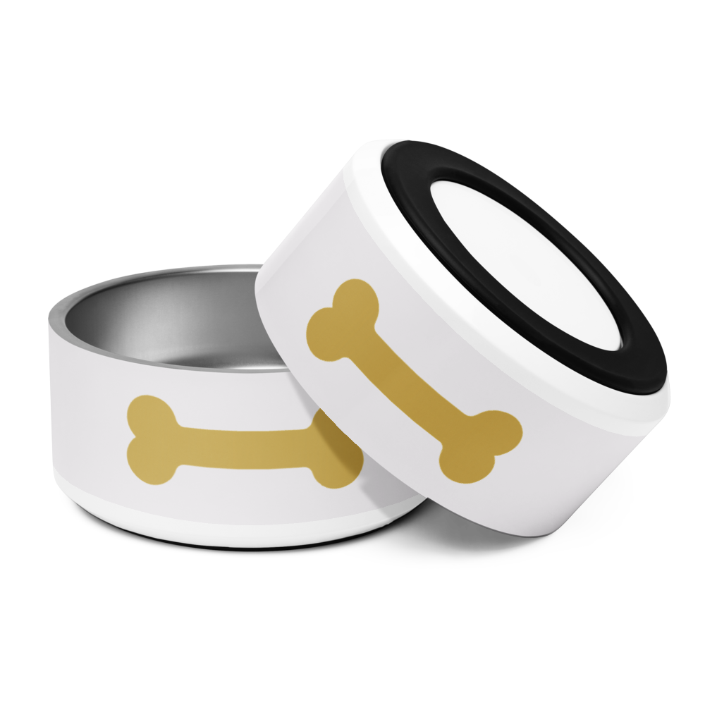 Ivory dog bowl with gold bone design 18 oz and inverted to show the nonslip base on a white background.