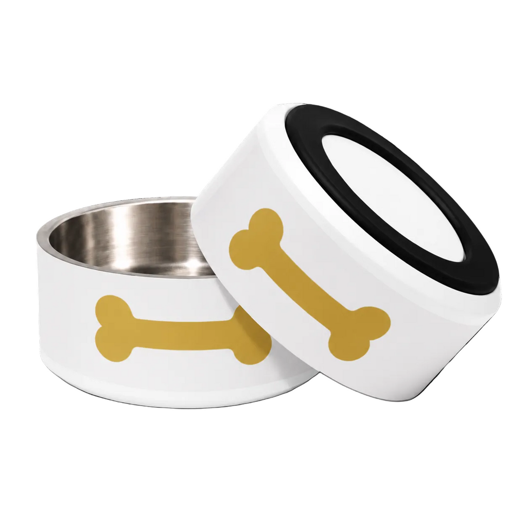 Two ivory dog bowls with a gold bone graphic and a rubber bottom, one standing upright and the other tilted showing a stainless steel, placed against a white background.
