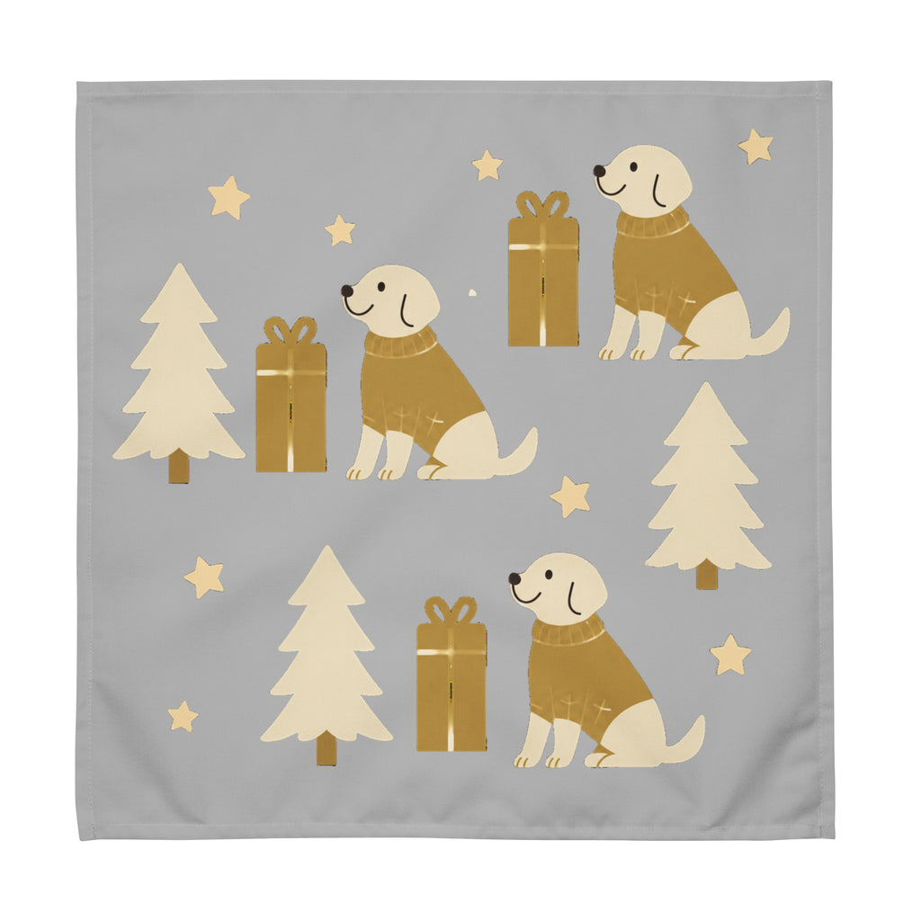 A square silver cloth napkin featuring a festive Christmas pattern with golden-brown dogs wearing sweaters, Christmas trees, gift boxes, and gold stars.