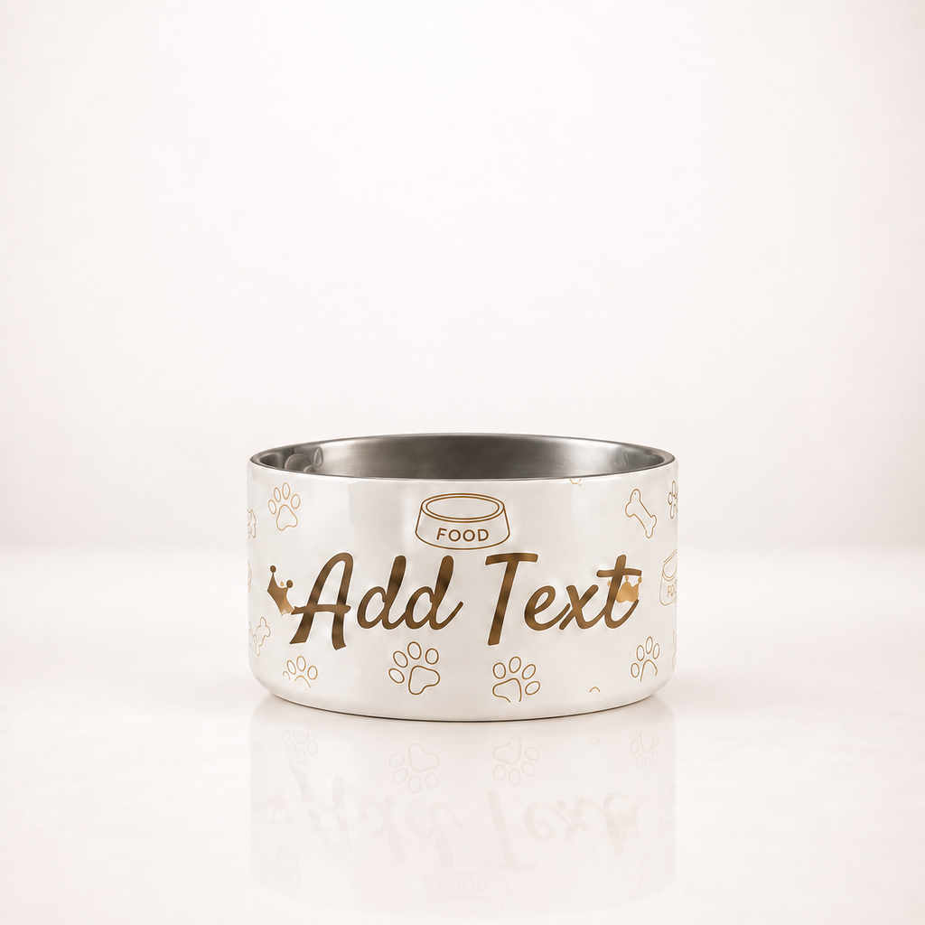A ivory dog bowl with a stainless steel interior, featuring customizable gold text and small pet crown, & paw, graphics on the front.