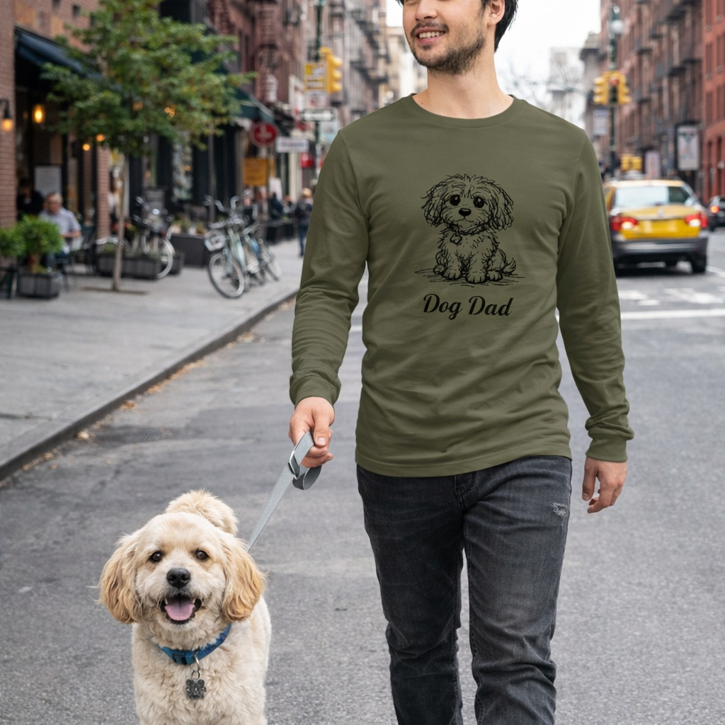 Military green personalized dog illusion long sleeve T-shirt with front-facing puppy illustration and custom Dog Dad text.

Man walking a dog on a city street wearing a long-sleeve shirt with 'Dog Dad' text.