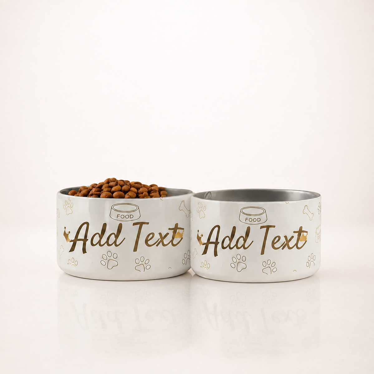 Two stylish personalized ivory stainless steel dog bowls with various patterns on a clean white background. 