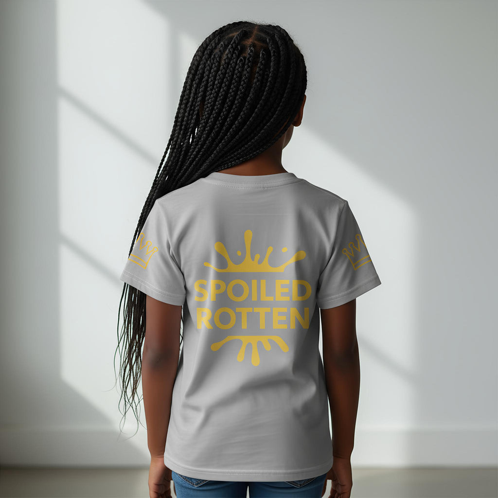 Girl wearing a size 7 gray and gold t-shirt with 'SPOILED ROTTEN' on a plain background