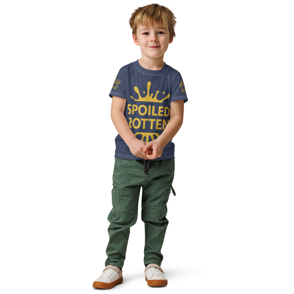 Boy wearing navy and gold Spoiled Rotten, graphic splash design and crown on both sleeves T-shirt front view on white background, by Uncommon Canine Couture Co.