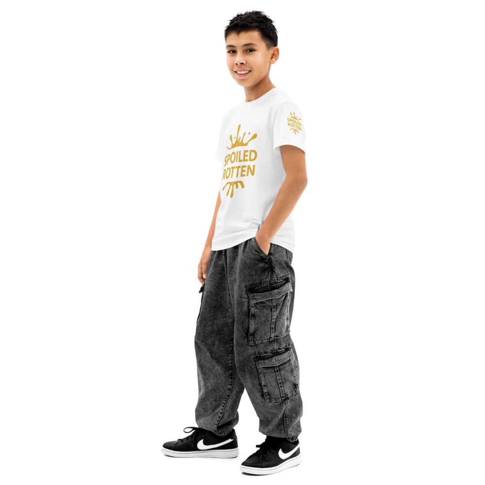 Teen boy wearing a white preppy t-shirt all over print ‘Spoiled Rotten’ on a white background