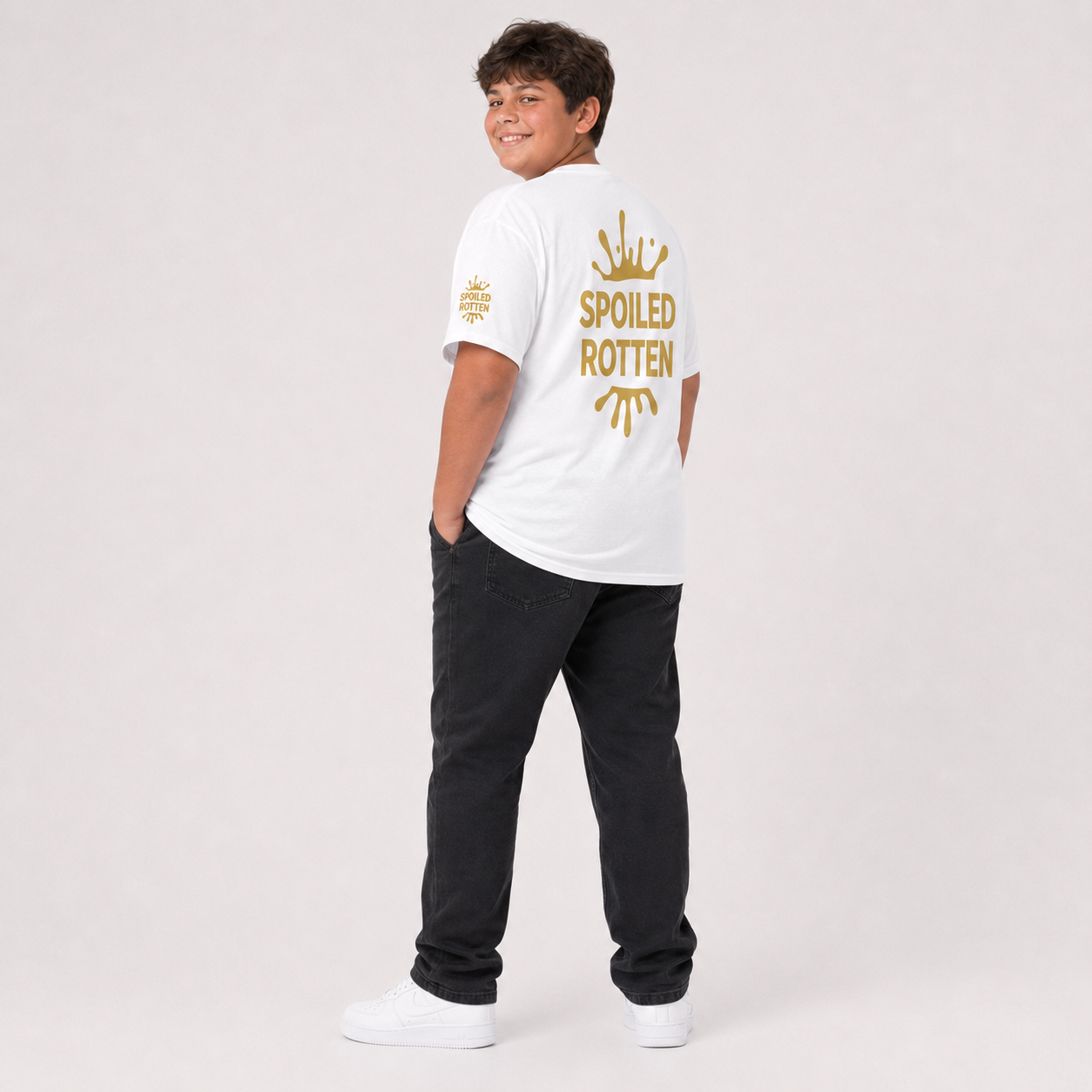 White t-shirt featuring a gold splash graphic and the text 'SPOILED ROTTEN' all over print design.