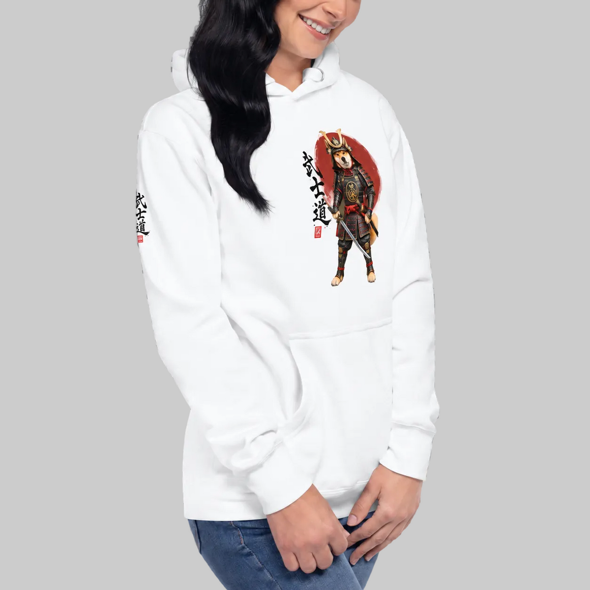 A woman wearing a white stylish pullover hoodie with a graphic print of a samurai warrior and all over print Japanese calligraphy.