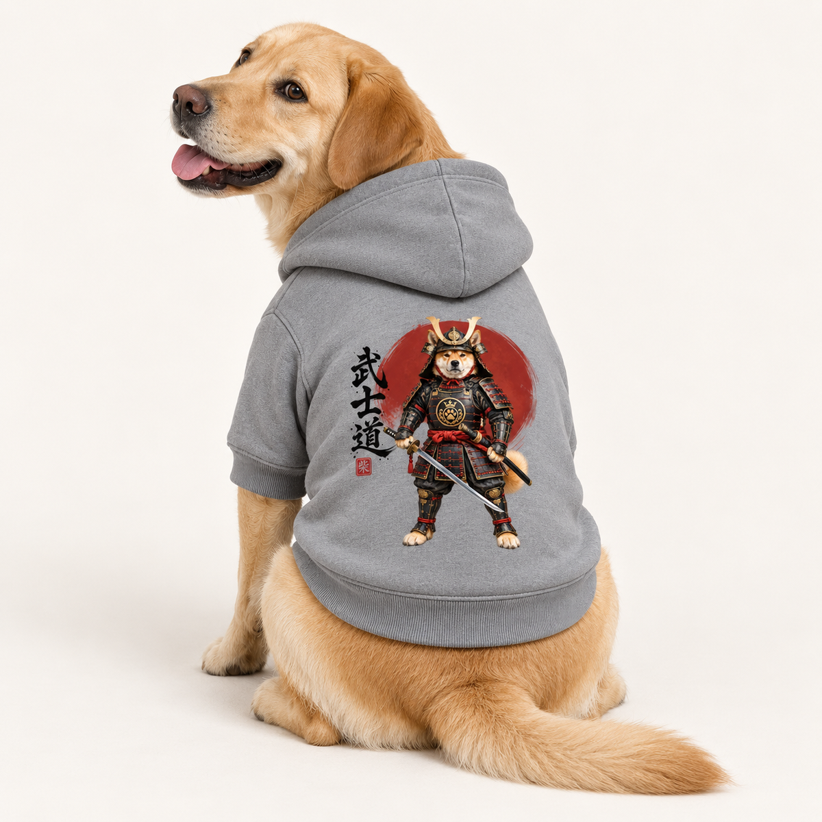 A medium dog wearing a gray pet hoodie with a Bushidō inspired artwork and Japanese text.