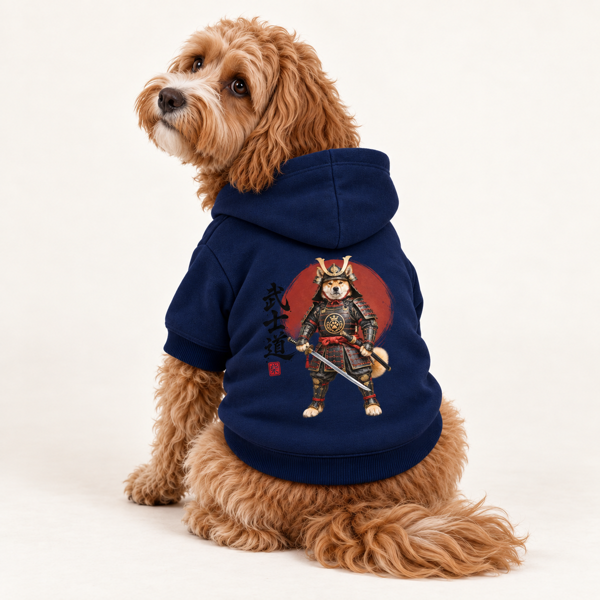 A Cavapoo wearing a navy blue pet hoodie with a Bushidō-inspired artwork and Japanese text by, Uncommon Canine Couture Co.