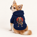 A small dog wearing a navy blue dog hoodie with a samurai graphic, photographed against a clean white studio background.