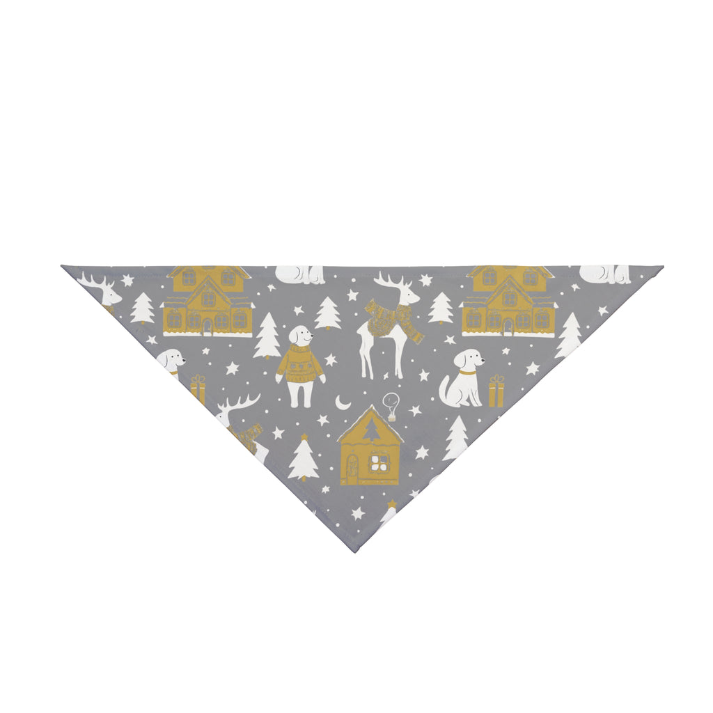 A dog bandana with a winter village pattern featuring golden houses, white dogs, reindeer, and pine trees.
