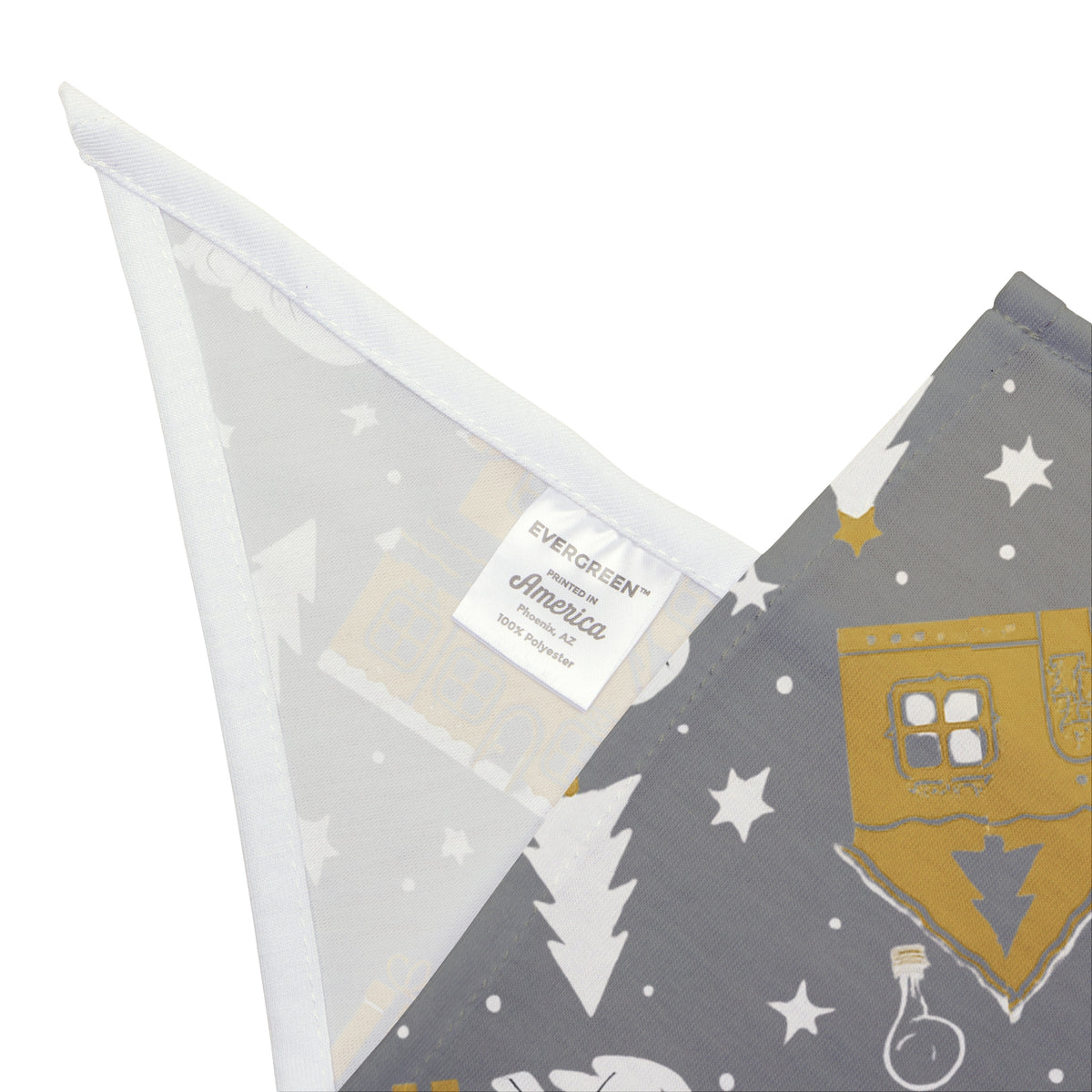A folded dog bandana featuring a winter theme pattern silver and gold. 