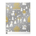 A flat sheet of wrapping paper featuring a cozy Christmas village design on a silver, gold and white background. 