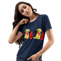 A woman wearing a navy blue t-shirt with a graphic print of dogs wearing red bandanas next to red fire hydrants.